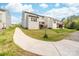 Backyard exterior shows the deck and the side yard in a townhome community at 6702 Carradale Way, Charlotte, NC 28278