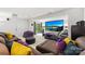 An entertainment room features a large projector screen, comfortable seating, and cozy lighting at 6702 Carradale Way, Charlotte, NC 28278