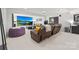 Finished basement boasts plush carpeting, a huge screen, and reclining furniture at 6702 Carradale Way, Charlotte, NC 28278