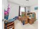 Partially packed bedroom featuring moving boxes, bright light, and an accent vase at 6702 Carradale Way, Charlotte, NC 28278