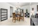 Dining room with a modern chandelier, neutral decor, and ample space for entertaining at 6702 Carradale Way, Charlotte, NC 28278