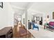 Bright foyer showcasing hardwood floors, an open floor plan, and contemporary decor at 6702 Carradale Way, Charlotte, NC 28278