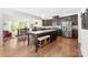 Spacious kitchen featuring dark cabinetry, stainless steel appliances, and a large center island at 6702 Carradale Way, Charlotte, NC 28278