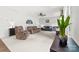 Cozy living room with neutral carpet, ceiling fan and comfortable seating at 6702 Carradale Way, Charlotte, NC 28278