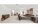 Spacious bedroom featuring neutral carpeting, modern decor, and abundant natural light at 6702 Carradale Way, Charlotte, NC 28278