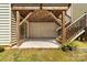 Outdoor patio below the deck offers room to entertain with stairs to the upper level at 6702 Carradale Way, Charlotte, NC 28278