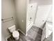 A full bathroom with a tub, shower, vanity, and toilet at 712 N Washington St, Shelby, NC 28150