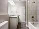 Bright bathroom showcases granite vanity, a tiled shower-tub, and sleek fixtures at 712 N Washington St, Shelby, NC 28150