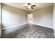 Spacious bedroom featuring wood-look floors and a ceiling fan at 712 N Washington St, Shelby, NC 28150
