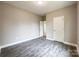 This bedroom offers gray walls, dark floors, white doors and trim, and spacious atmosphere at 712 N Washington St, Shelby, NC 28150