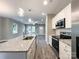 Open floor plan showcasing modern kitchen with island and stainless steel appliances at 712 N Washington St, Shelby, NC 28150