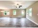 Inviting living room with wood-look floors, neutral walls, and many windows for plenty of natural light at 712 N Washington St, Shelby, NC 28150
