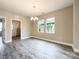 A well lit living room showcases wood-look floors, neutral walls and view into another room at 712 N Washington St, Shelby, NC 28150