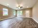 Inviting living room with wood-look floors, neutral walls, and windows offering natural light at 712 N Washington St, Shelby, NC 28150