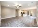 Open-concept living area with wood-look floors and a view of the kitchen and dining area at 712 N Washington St, Shelby, NC 28150