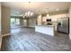 An open-concept living space with modern kitchen, hardwood floors, and abundant natural light at 712 N Washington St, Shelby, NC 28150