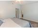 Spacious bedroom featuring hardwood floors, and an ensuite bathroom at 8251 Tradd Ct, Charlotte, NC 28210