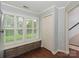 Bonus room with plantation shutters, natural light, and view to outside at 8251 Tradd Ct, Charlotte, NC 28210