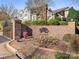 Attractive gated community entrance with brick wall, landscaping and signage for Quail Hollow at 8251 Tradd Ct, Charlotte, NC 28210