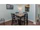 Dining area with four-chair dining table and view to kitchen at 8251 Tradd Ct, Charlotte, NC 28210