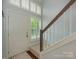 Bright entryway with staircase, natural light and views to the outside at 8251 Tradd Ct, Charlotte, NC 28210