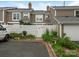 Townhome exterior with white fence and well-kept garden at 8251 Tradd Ct, Charlotte, NC 28210