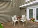 A charming outdoor patio with seating, perfect for relaxing or entertaining at 8251 Tradd Ct, Charlotte, NC 28210