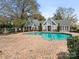 Community pool with brick pavers, perfect for summer relaxation at 8251 Tradd Ct, Charlotte, NC 28210
