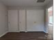 Bedroom with large closets and laminate flooring provides ample storage and easy maintenance at 8332 Highlander Ct, Charlotte, NC 28269