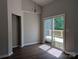 Bright dining area with sliding glass doors leading to outdoor deck provides a seamless indoor-outdoor flow at 8332 Highlander Ct, Charlotte, NC 28269