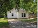 Exterior showcases a well-maintained lawn, classic siding, and an inviting driveway at 8332 Highlander Ct, Charlotte, NC 28269