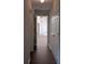 Hallway with hardwood floors leads to a bright living space, and has access to multiple rooms at 8332 Highlander Ct, Charlotte, NC 28269