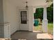Inviting porch with classic columns and entrance provides a warm welcome at 8332 Highlander Ct, Charlotte, NC 28269