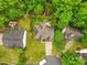An aerial view shows the home with a large yard and many mature trees at 9010 Davis Crossing Ct, Charlotte, NC 28269