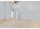 Large bonus room with neutral carpet and a vaulted ceiling at 9010 Davis Crossing Ct, Charlotte, NC 28269
