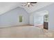 Expansive bonus room with neutral carpet and lots of natural light at 9010 Davis Crossing Ct, Charlotte, NC 28269