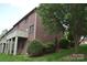 Brick home with a small, partially shaded backyard at 904 3Rd Street Ne Pl, Conover, NC 28613