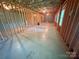 Unfinished basement with concrete floor, block walls, and exposed ceiling beams at 904 3Rd Street Ne Pl, Conover, NC 28613