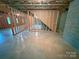 Spacious unfinished basement with exposed framing and concrete floors at 904 3Rd Street Ne Pl, Conover, NC 28613