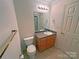 Full bathroom with vanity, toilet, shower, and tile flooring at 904 3Rd Street Ne Pl, Conover, NC 28613