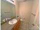 Bathroom with vanity, large mirror, and neutral tones at 904 3Rd Street Ne Pl, Conover, NC 28613