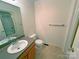 Tiled bathroom with vanity, toilet, and shower-tub combo at 904 3Rd Street Ne Pl, Conover, NC 28613