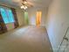 Bedroom with carpet, ceiling fan, and a glimpse into a walk-in closet at 904 3Rd Street Ne Pl, Conover, NC 28613