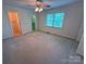 Bedroom with natural light, ceiling fan, and closet, with a neutral color scheme at 904 3Rd Street Ne Pl, Conover, NC 28613