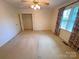 Carpeted bedroom with closet and large window at 904 3Rd Street Ne Pl, Conover, NC 28613
