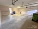 Large two car garage featuring ample space, lighting, and two overhead doors at 904 3Rd Street Ne Pl, Conover, NC 28613