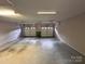 Spacious two car garage with painted floor and two overhead doors at 904 3Rd Street Ne Pl, Conover, NC 28613