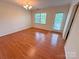 Bright living room featuring hardwood floors, a chandelier, a window, and a glass paneled exterior door at 904 3Rd Street Ne Pl, Conover, NC 28613