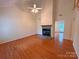 Bright living room featuring a fireplace and hardwood flooring at 904 3Rd Street Ne Pl, Conover, NC 28613
