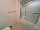 A close-up of the shower with gold trim and towel bar at 904 3Rd Street Ne Pl, Conover, NC 28613